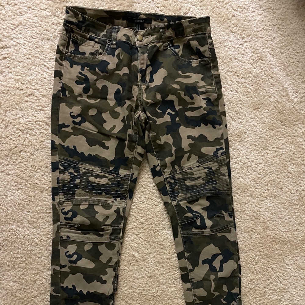 Camp pants with stitching and zipper details.